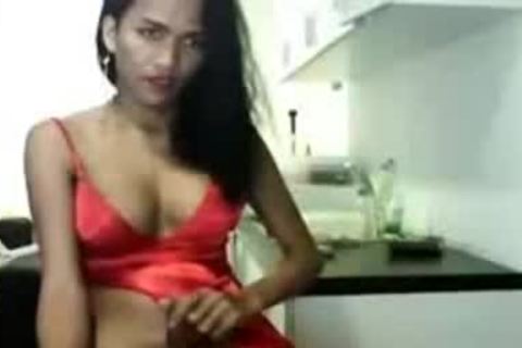 sleazy Asain tranny In Red suit Cums